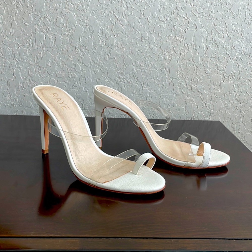 Clear vinyl upper with leather sole
Slip-on styling
Heel measures approx 3.5" H